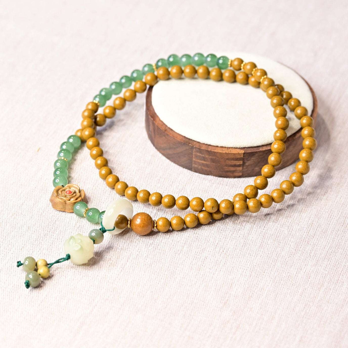 A handmade aromatic necklace crafted from natural herbs &amp; wood beads—designed to soothe, balance, and gently clear dampness.